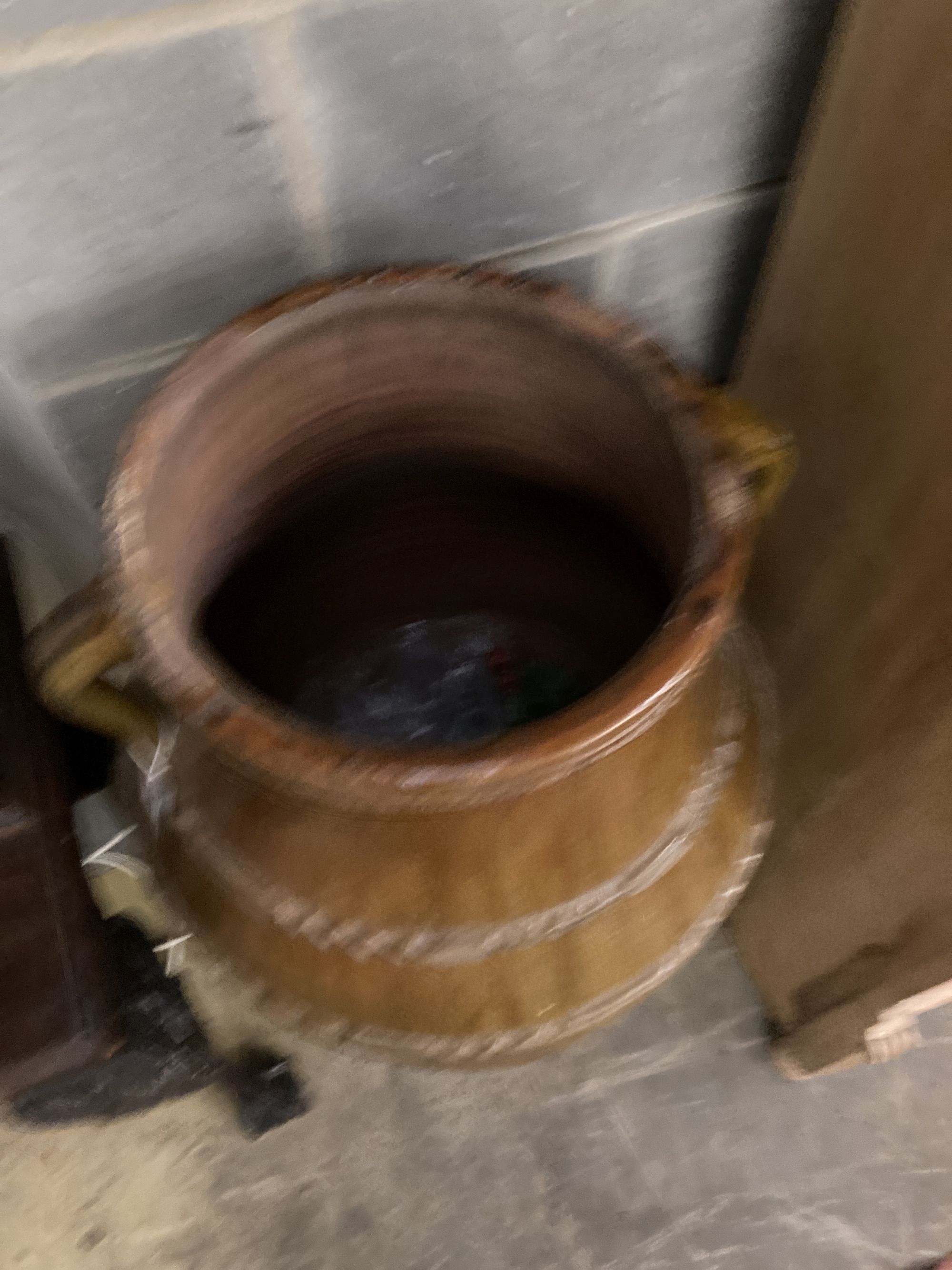 A Portuguese two-handled pottery oil jar, of waisted tapered ovoid form, height 105cm